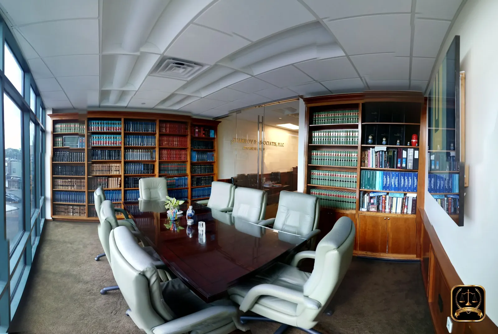 Conference room with law library shelves at the Sharifov & Associates, PLLC Brooklyn office